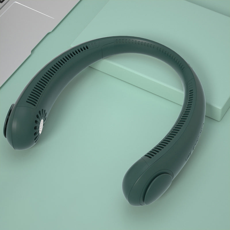 Gray neck massager on a light green surface